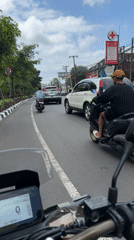 Motorcyclist captures daytime street scenes in Kuta Selatan, Indonesia