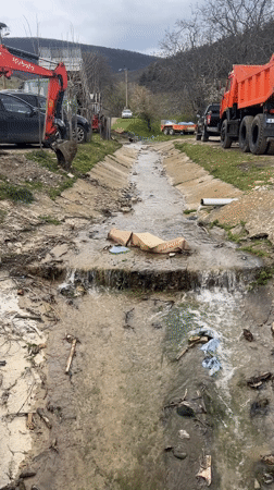 Rural Bulgaria scenes show polluted stream, grazing sheep