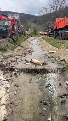 Rural Bulgaria scenes show polluted stream, grazing sheep