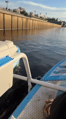 Afternoon on the Tura River — paddleboards, boats, and riverside chill