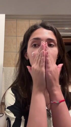 Woman's Evening Beauty Routine Captured in Montenegro Bathroom