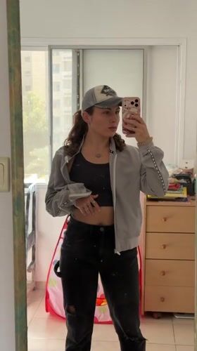Woman takes mirror selfies in Kiryat Bialik, Israel