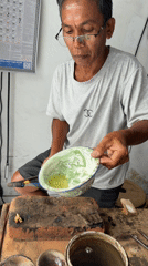 Traditional jeweler crafts rings at Indonesian workshop