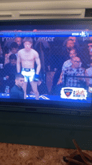 Person watches UFC fight on tablet in Paris