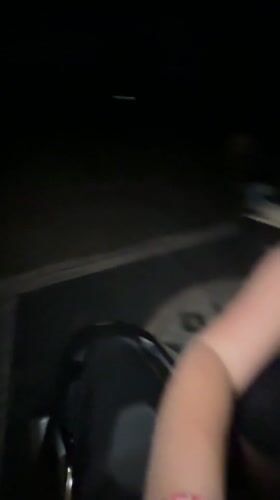 Woman takes nighttime selfies by motorcycle in Indonesia