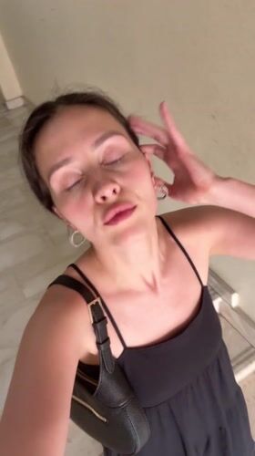 Young woman observed in hallway in Abu Dhabi
