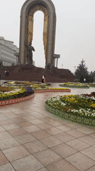 Rainy morning walk documented through ornate Dushanbe public park