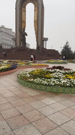 Rainy morning walk documented through ornate Dushanbe public park