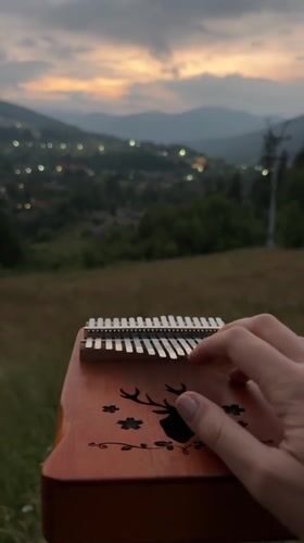 Kalimba, flag, and Carpathian sunsets in Tatariv