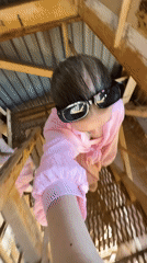 Woman, child explore industrial metal structures in Rusalevka