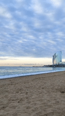 Early morning beach scenes documented along Barcelona coastline
