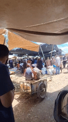 Rural marketplace bustling with shoppers in Ahrara, Morocco