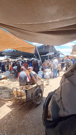 Rural marketplace bustling with shoppers in Ahrara, Morocco