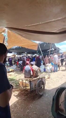 Rural marketplace bustling with shoppers in Ahrara, Morocco