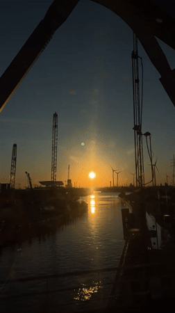 Sunset captured over Port of Antwerp industrial landscape