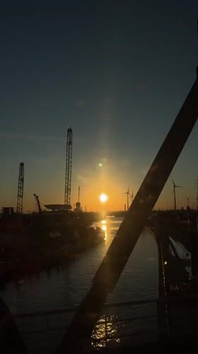 Sunset captured over Port of Antwerp industrial landscape