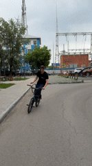 Cyclist rides BMX bike through Tyumen streets