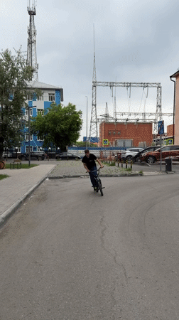 Cyclist rides BMX bike through Tyumen streets