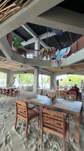 Beachside restaurant and BMW motorcycle in Gerokgak, Bali