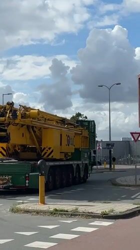 Crane truck and parking control vehicle spotted in Amsterdam