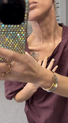 Woman documents rhinestone craft project in Abakan, Russia
