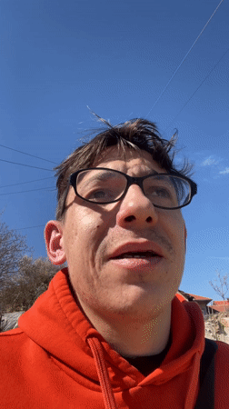 Man discusses Cyprus travel plans in Bulgarian countryside