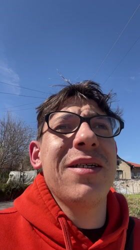 Man discusses Cyprus travel plans in Bulgarian countryside