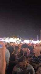 Nighttime carnival crowds light up Barakaldo