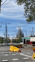 Tram crosses Barcelona street near Sagrada Familia