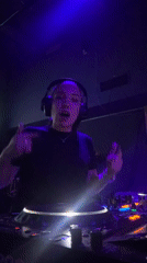 Female DJ performs with stage lights in Moscow