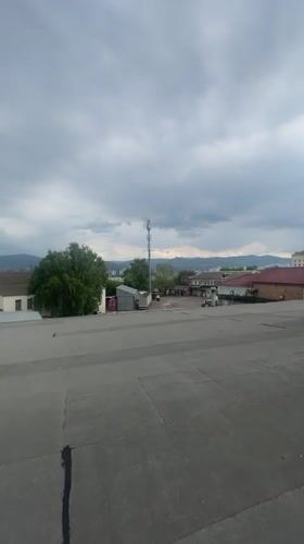 Overcast rooftop view across Krasnoyarsk's urban and industrial sprawl