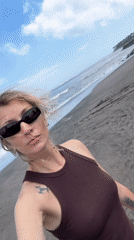 Person and leashed dog spotted on Mengwi beach