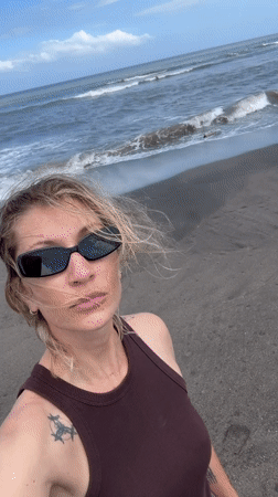 Person and leashed dog spotted on Mengwi beach