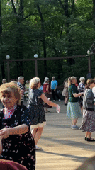 Summer afternoon in a Moscow park: flowers, dancing, blue skies