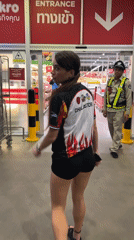 Woman in CHULASTORE jersey shops at Thai warehouse store