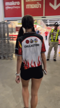Woman in CHULASTORE jersey shops at Thai warehouse store