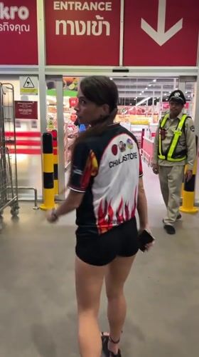 Woman in CHULASTORE jersey shops at Thai warehouse store