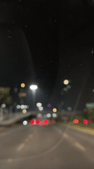 Night driving captured during rainfall in Tlaxcalancingo, Mexico