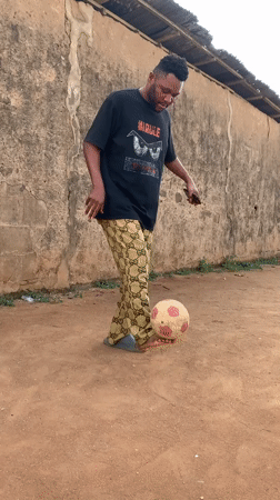 Man practices soccer skills in Ikorodu yard