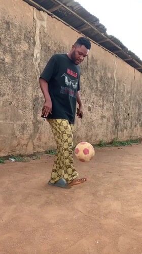 Man practices soccer skills in Ikorodu yard