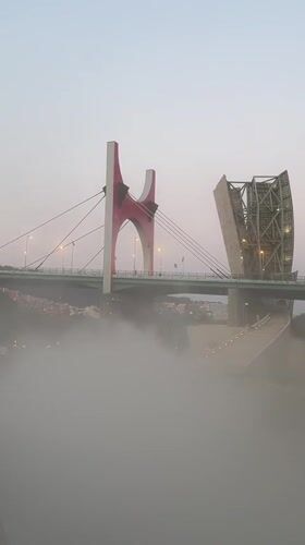 Evening stroll along Bilbao's riverfront: Zubizuri, Guggenheim, and Puppy