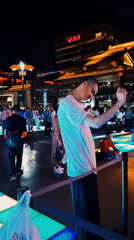 Nighttime festivities captured in illuminated Yanta District square