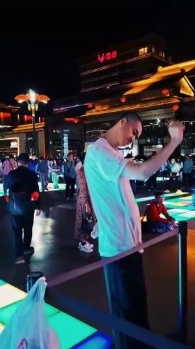 Nighttime festivities captured in illuminated Yanta District square