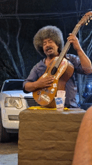Street musician performs late-night show in Valencia, Venezuela