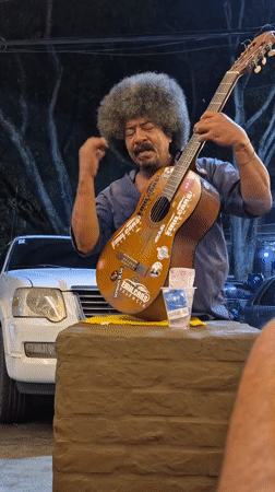Street musician performs late-night show in Valencia, Venezuela