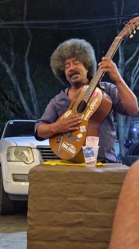 Street musician performs late-night show in Valencia, Venezuela