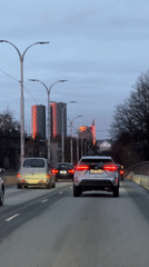 Evening traffic captured on Riga road during overcast dusk