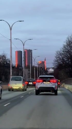 Evening traffic captured on Riga road during overcast dusk