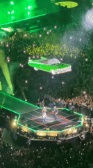 Milan concert features green car stage prop and lighting effects