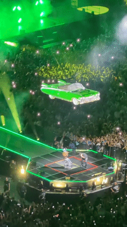 Milan concert features green car stage prop and lighting effects